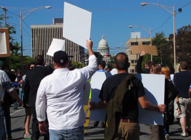 Protesters march toward the State Capitol Saturday morning.