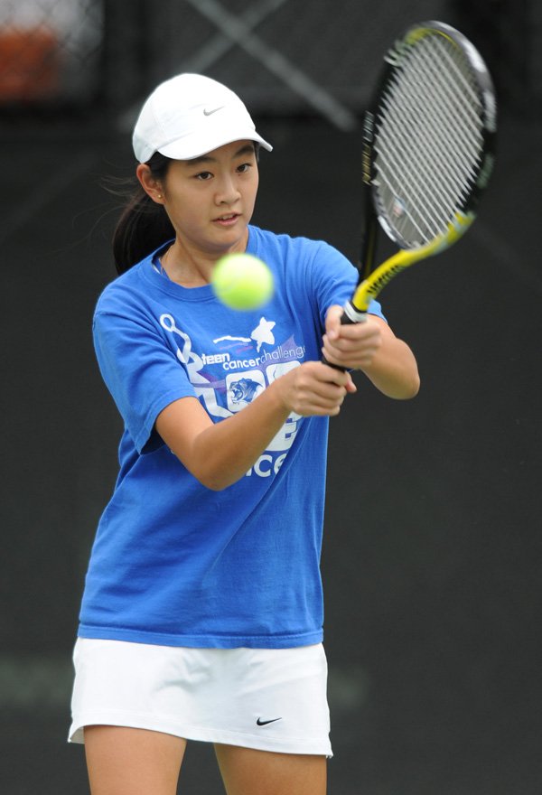 Rogers’ Tiffany Tang returns a shot Tuesday during the Class 7A state championships at the George M. Billingsley Tennis Center on the University of Arkansas campus. Go to <a href="http://www.nwaonline.com/photoreprints">nwaonline.com/photoreprints</a> to see more photos.