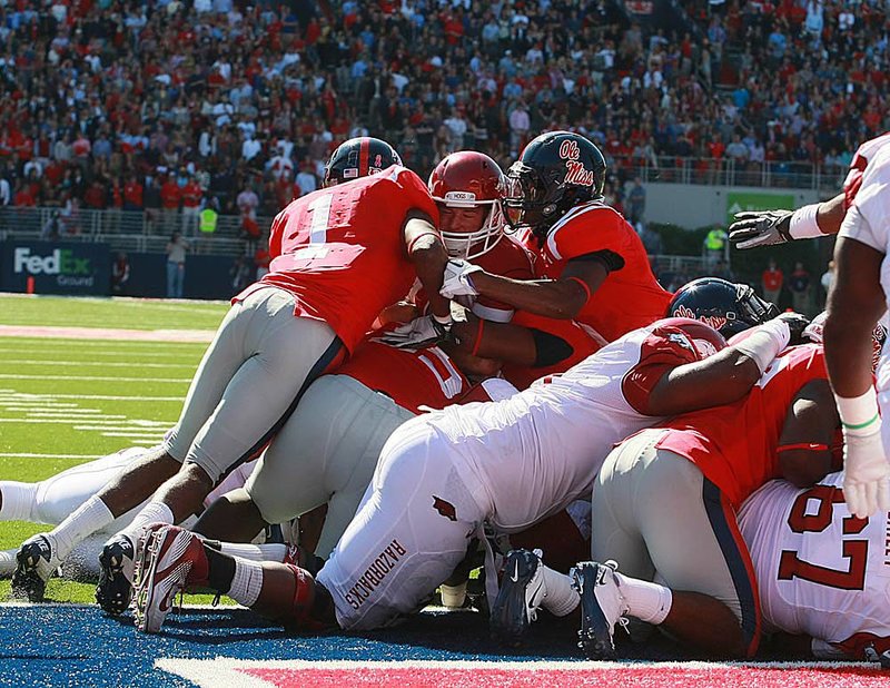 Arkansas’ Tyler Wilson was stopped short of the end zone on this third-down play but scored on a fourth-down bootleg. 