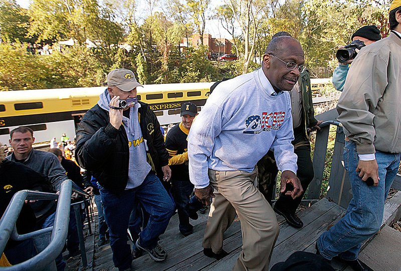 Republican presidential
candidate Herman Cain visits Kinnick Stadium in Iowa City, Iowa, before Iowa’s football game Saturday against Indiana.
