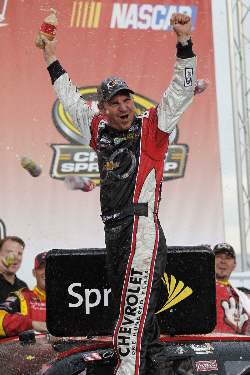 Clint Bowyer celebrates his victory in Sunday’s NASCAR Sprint Cup race at Talladega Superspeedway in Alabama. 