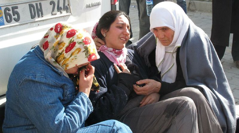 Two women comfort a friend who was in mourning Monday for her parents, who died in Sunday’s earthquake in Turkey. 