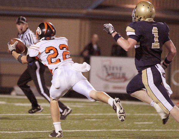 Gravette senior Jordan Lundholm pulls in a pass in play against Shiloh Christian Friday night in Springdale.
