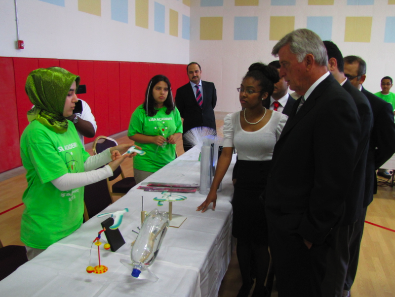 Gov. Mike Beebe visits with students at a science fair Tuesday after a ceremonial ribbon cutting at LISA Academy's new high school building.