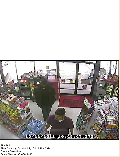 Video surveillance photos of two suspects who allegedly robbed the Valero gas station on Fair Park Boulevard on Friday morning.