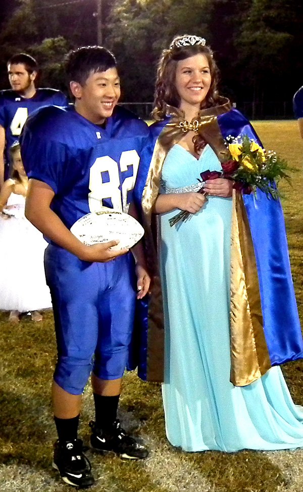 Homecoming captain Nou Thor and queen Seanna Shaw pose for a photo.
