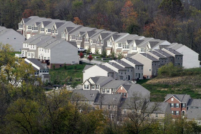 Prices of homes, like these in a new development in Canonsburg, Pa., were little changed in 20 cities for August, according to reports. 