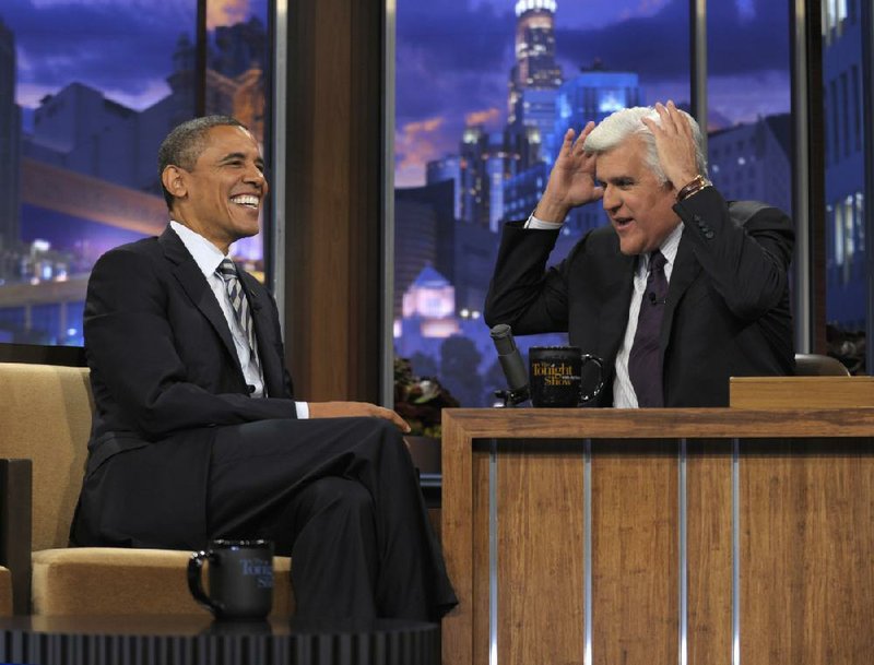 President Barack Obama talks with Jay Leno between segments of an interview being taped in Burbank, Calif., and set to air Tuesday on NBC’s The Tonight Show. 