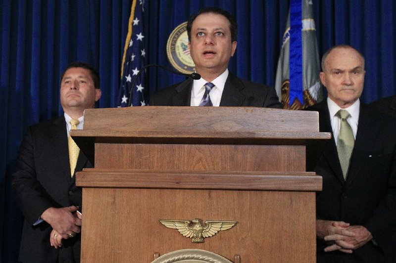 U.S. Attorney Preet Bharara, accompanied Tuesday at a New York City news conference by FBI Special Agent in Charge Diego Rodriguez (left) and New York City Police Commissioner Raymond Kelly, announces the arrests of five police officers. 