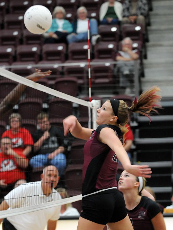 Siloam Springs’ Makenzie Sharp pushes the ball over the net against Magnolia on Tuesday in the first round of the Class 5A State Volleyball Tournament at Panther Arena in Siloam Springs.