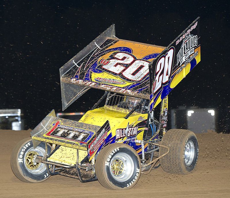 Greg Wilson, of Benton Ridge, Ohio, slides his No. 20 Maxim sprinter into turn 3 at I-30 Speedway last year. 