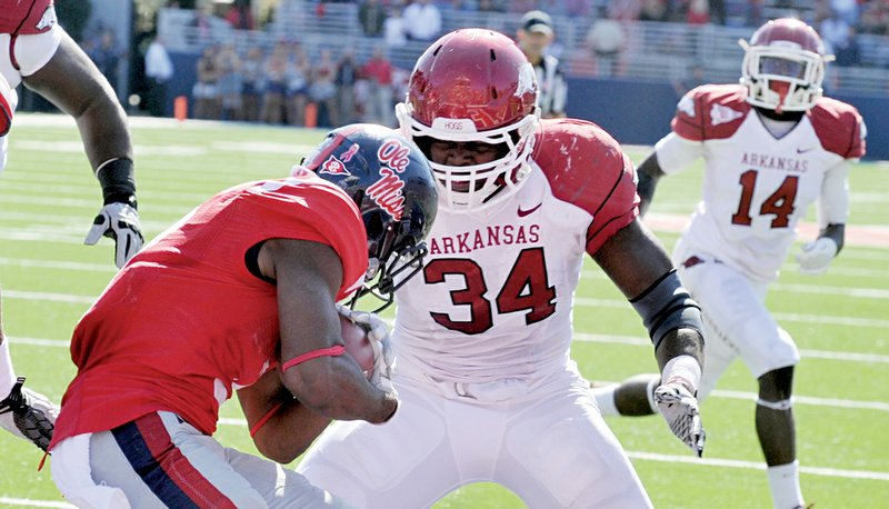 University of Arkansas defender Jerry Franklin puts the stop on Ole Miss runningback Jeff Scott in the end zone to score a safety in the third quarter of Saturday's game.