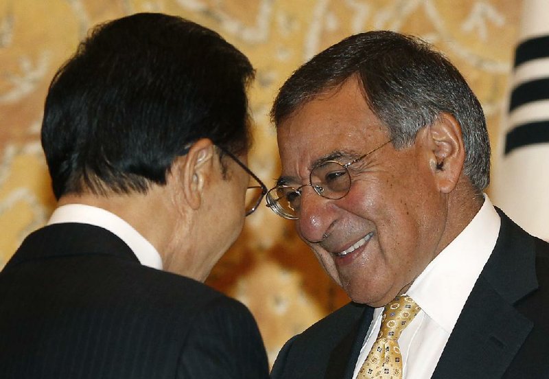 Visiting U.S. Defense Secretary Leon Panetta, right, listens to South Korean President Lee Myung-bak during their meeting at the presidential Blue House in Seoul Thursday, Oct. 27, 2011. Panetta, on the final leg of a weeklong Asia tour, is holding a series of meetings with South Korean leaders to offer assurances of American support in the face of North Korean threats. (AP Photo/Jo Yong-hak, Pool)