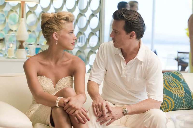 Chenault (Amber Heard) makes her intentions clear to Paul Kemp (Johnny Depp) in The Rum Diary, the film version of the late Hunter S. Thompson’s autobiographical novel. 