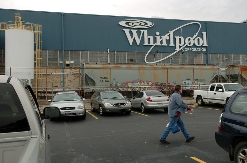 A Whirlpool employee walks across the parking lot during the afternoon shift change at the Fort Smith plant Friday, Nov. 14, 2008.