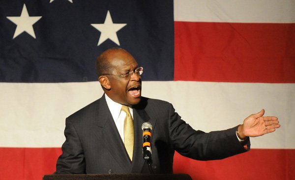 Herman Cain, GOP presidential candidate, speaks Thursday at the Washington County Lincoln Day Dinner at the Northwest Arkansas Convention Center in Springdale. Cain spoke to a crowd of 1,450 people, making it the largest crowd in the history of the event. Cain is one of several candidates running for the Republican nomination for president the 2012 election.
