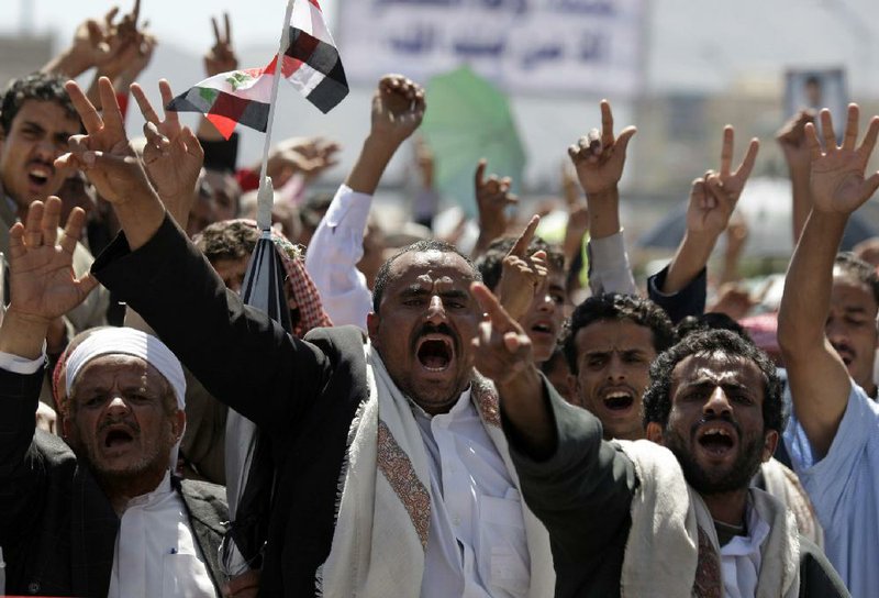 Protestors chant slogans during a demonstration demanding the resignation of Yemeni President Ali Abdullah Saleh in Sanaa, Yemen, Friday, Oct. 28, 2011. (AP Photo/Hani Mohammed)