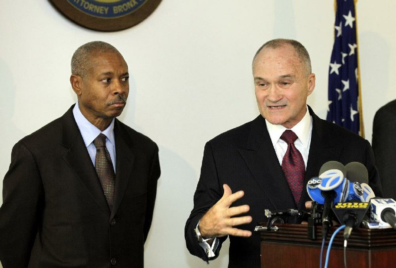 Bronx District Attorney Robert Johnson (left) and Police Commissioner Raymond Kelly speak after 16 police officers were indicted on corruption charges Friday in New York. 