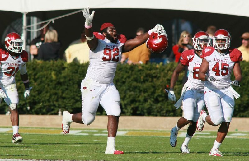 Arkansas defensive tackle D.D. Jones (92) runs off the field after Vanderbilt kicker Carey Spear missed a field goal that would have tied the game in the fourth quarter of Saturday’s game. Arkansas won 31-28 and moved up three spots in the BCS rankings.

