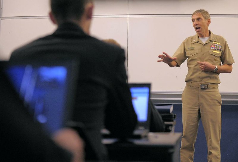 Midshipmen 4th Class students listen to Capt. Steven Simon, who instructs them set up a WAP (wireless access point) in Michelson Hall at the U.S. Naval Academy in Annapolis, Maryland, October 19, 2011. (Karl Merton Ferron/Baltimore Sun/MCT)