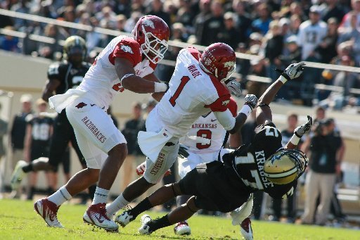 Arkansas' Marquel Wade (1) was ejected for hitting Vanderbilt's Jonathan Krause (17), who signaled for a fair catch of a punt, in the 3rd quarter of the game at Vanderbilt Stadium in Nashville, Tenn., on Oct. 29, 2011.
