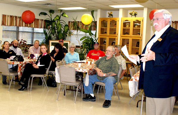 Benton County Judge Bob Clinard presided at a 'county hall' meeting last Monday evening at Gravette where he, and other county officials and employees, visited with citizens, answering questions and explaining county activities.
