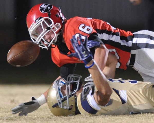 Jacob Naylor, Farmington defender, strips the ball from Ryan Michaelis, Shiloh Christian junior receiver, on Friday during the first half of play at Allen Holland Field in Farmington.
