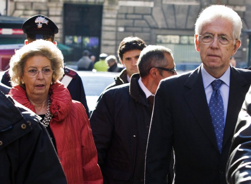 Italian Economist Mario Monti and his wife Elsa leave St. Ivo church at the end of a mass in Rome, Sunday, Nov. 13, 2011.