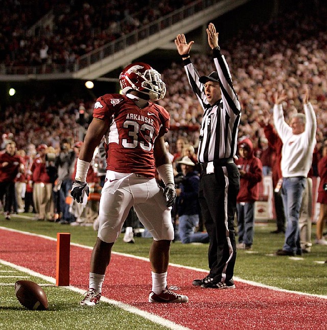 Arkansas running back Dennis Johnson scored on two touchdown runs of 71 and 15 yards Saturday at Reynolds Razorback Stadium in Fayetteville, helping the Razorbacks post a 49-7 victory over Tennessee and rise from No. 8 to No. 6 in the BCS standings. 