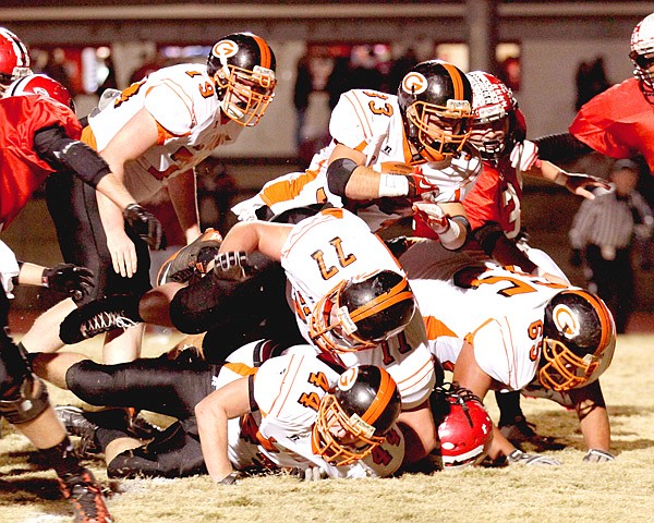 Gravette senior Darrick Strzelecki dives over the line to score in play against Pocahontas on Friday. Strzelecki led the Lions with 158 rushing yards against the Redskins.
