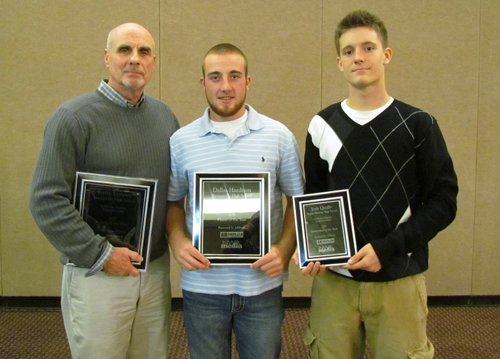 Bentonville coach Barry Lunney (left), Bentonville quarterback Dallas Hardison (center) and Rogers Heritage quarterback Josh Qualls (right) received annual awards Wednesday at the Northwest Arkansas Touchdown Club. 