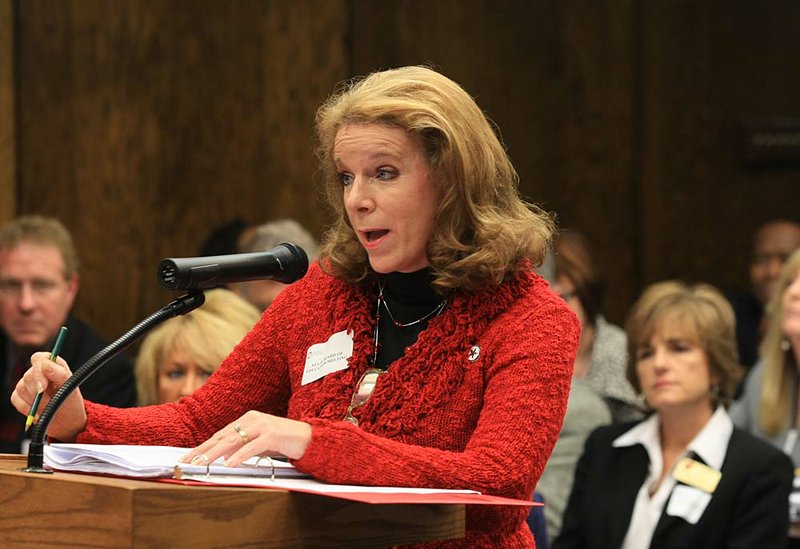 Diploma School proponent Sally Wilson of Osceola speaks Tuesday at a state Board of Education meeting in Little Rock. At right is Jonesboro School District Superintendent Kim Wilbanks. 