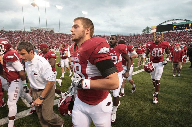 Arkansas Razorbacks tight end Garrett Uekman (No. 88) runs off the field at halftime of their  game Saturday against Mississippi State at War Memorial Stadium.