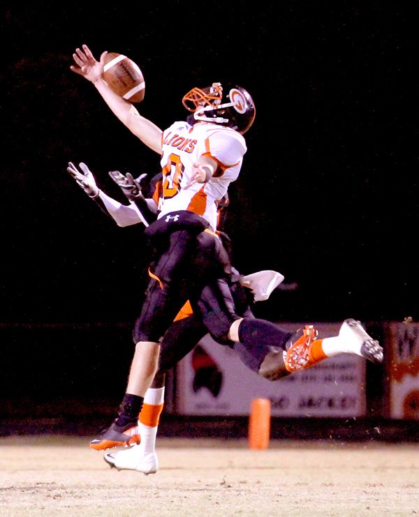 Gravette senior Clayton Alexander breaks up a pass play against Warren on Friday.