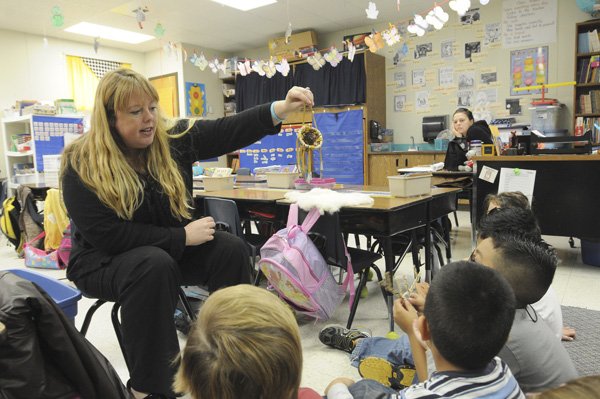 Krista Roth, a teacher at Bonnie Grimes Elementary, shows Native American art from her time as a teacher on an Indian reservation in Arizona.
