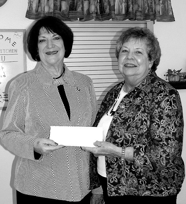 State Representative Mary Lou Slinkard, left, presents the check to Mary Kay Kelley.