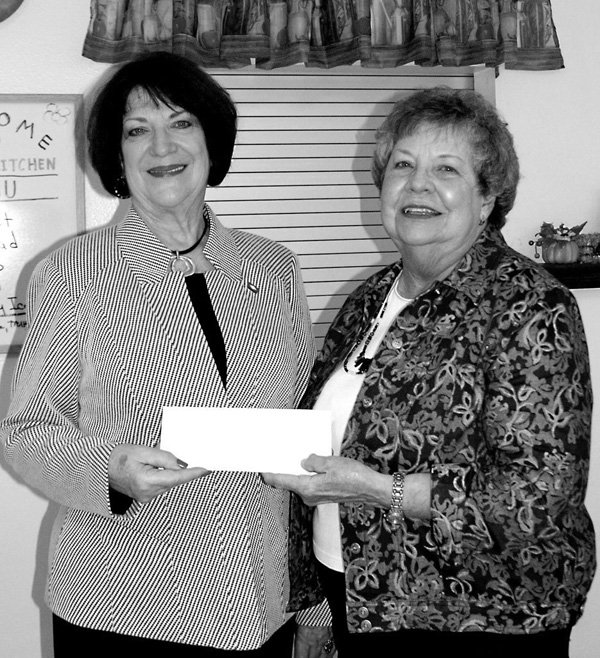 State Representative Mary Lou Slinkard, left, presents the check to Mary Kay Kelley.