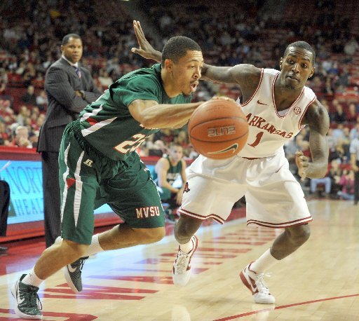 Arkansas Democrat-Gazette/MICHAEL WOODS -- 11/30/2011 -- Arkansas guard Mardracus Wade puts the pressure on Mississippi Valley State 's Kevin Burwell in the first half of Wednesday evening's game at Bud Walton Arena in Fayetteville.