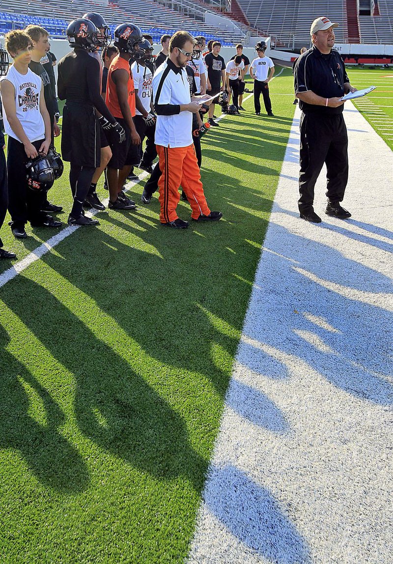 Batesville Coach Dave King and his team run drills during a walkthrough practice Friday at War Memorial Stadium in Little Rock in preparation for Saturday’s Class 5A state championship game against Greenwood. 