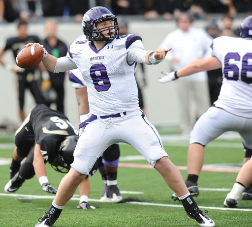 Fayetteville junior quarterback Austin Allen passes through the Bentonville defense Dec. 3 during the Class 7A state championship game in War Memorial Stadium in Little Rock.