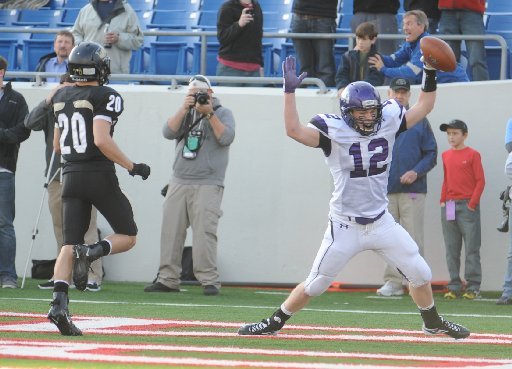 Fayetteville senior tight end Tyler Tuck, right, celebrates after catching the go-ahead 2-point PAT in the end zone in front of the Bentonville defense Saturday, Dec. 3, 2011, in the Class 7A state championship game in War Memorial Stadium in Little Rock.