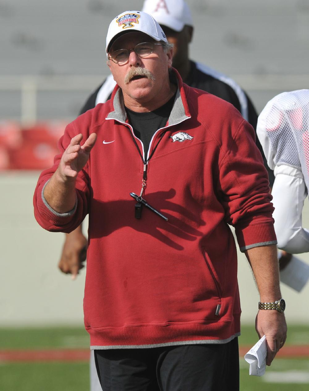 Arkansas Democrat-Gazette/MICHAEL WOODS --12/21/10-- University of Arkansas defensive coordinator Willy Robinson works with the defense during practice Tuesday morning at Razorback stadium in Fayetteville.