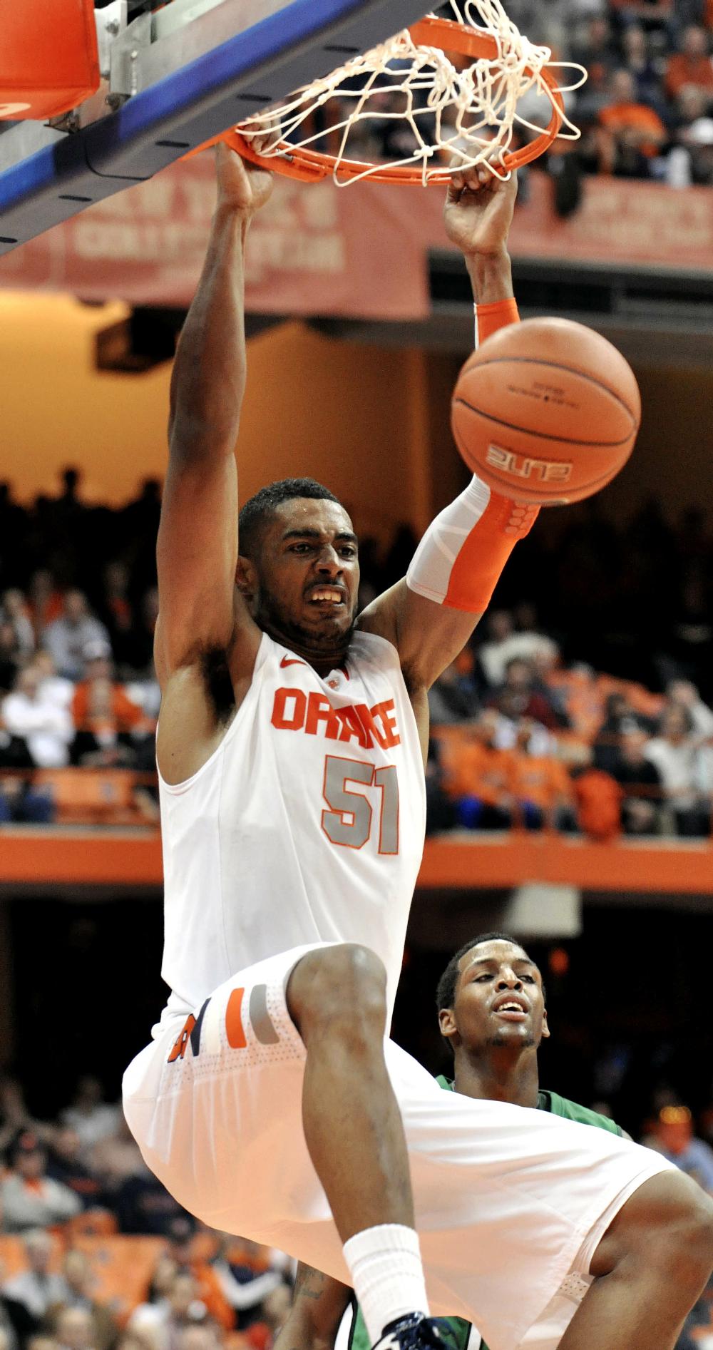 Syracuse's Fab Melo dunks against Marshall during the second half of an NCAA college basketball game in Syracuse, N.Y., Tuesday, Dec. 6, 2011. Syracuse won 62-56. (AP Photo/Kevin Rivoli)