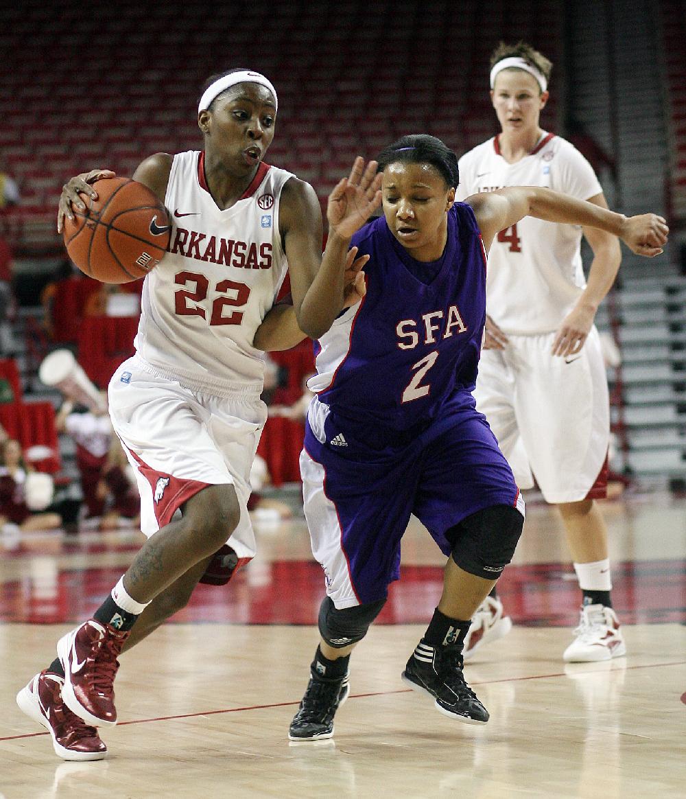 Arkansas Democrat-Gazette/WILLIAM MOORE
Arkansas' C'eira Ricketts drives against Stephen F. Austin's Courtney Conwright Tuesday, December 6, 2011 at Bud Walton Arena in Fayetteville.