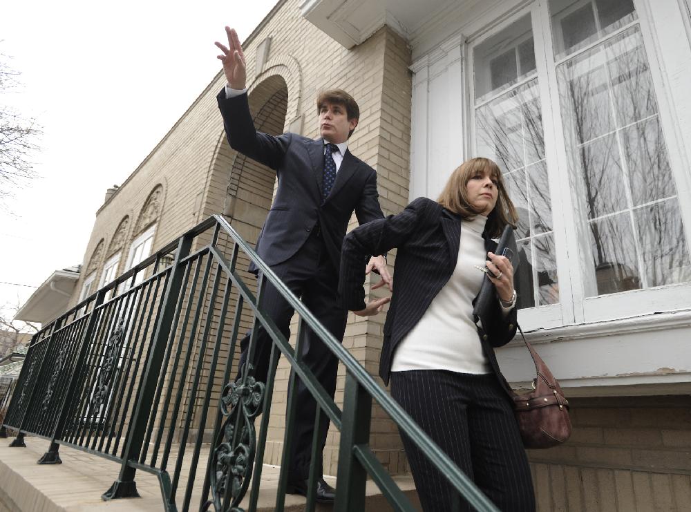 Former Illinois Governor Rod Blagojevich and his wife Patti leave their home heading to federal court for his sentencing hearing in Chicago, Tuesday, Dec. 6, 2011. Blagojevich was convicted earlier this year on 18 corruption counts, including trying to auction off President Barack Obama's old U.S. Senate seat. (AP Photo/Paul Beaty)