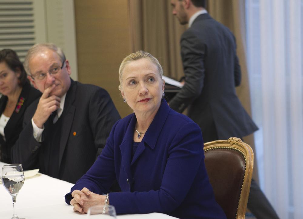 With concern mounting over the crisis in Syria and President Bashar Assad's crackdown on dissent, U.S. Secretary of State Hillary Rodham Clinton meets with a small group of expatriate Syrian opposition members, at an hotel in Geneva, Switzerland, Tuesday, Dec. 6, 2011. (AP Photo/J. Scott Applewhite, Pool)