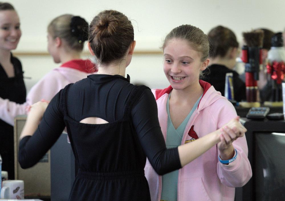 11/20/11
Arkansas Democrat-Gazette/STEPHEN B. THORNTON
Lauren-Frances Wood, 12, left, hugs friend BLANK as they horse around before rehearsal for Ballet Arkansas' The Nutcracker Sunday afternoon at Shuffles & Ballet II in Little Rock.