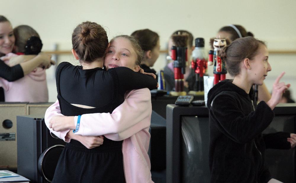 11/20/11
Arkansas Democrat-Gazette/STEPHEN B. THORNTON
Lauren-Frances Wood, 12, second from left, hugs friend BLANK, left,  as they and Kathryn Latham, 14, right, horse around before rehearsal for Ballet Arkansas' The Nutcracker Sunday afternoon at Shuffles & Ballet II in Little Rock. Wood and  Latham  will alternate playing the role of Clara in the ballet.