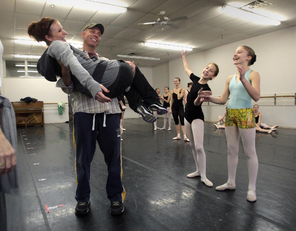 11/20/11
Arkansas Democrat-Gazette/STEPHEN B. THORNTON
Lauren-Frances Wood, 12, right, and Kathryn Latham, 14,  second from right, joke with co-director Allison Stodola, left, as Stodola demonstrates the lift by Stephen Stone during rehersal for  Ballet Arkansas' The Nutcracker Sunday afternoon at Shuffles & Ballet II in Little Rock. The girls will alternate playing the role of Clara in the ballet.