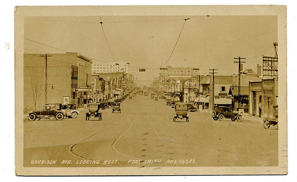 Fort Smith, 1927 This shot was taken on Garrison Avenue, the Sebastian County seat main street, looking west. Note the number of Model T Fords and the street car tracks. This was the last year of production for Henry Ford in Lizzie.At the time of this photo, the city had a population of almost 30,000. Today the population is more than 86,000.
Send questions or comments to Arkansas Postcard Past, P.O. Box 2221, Little Rock, Ark. 72203.